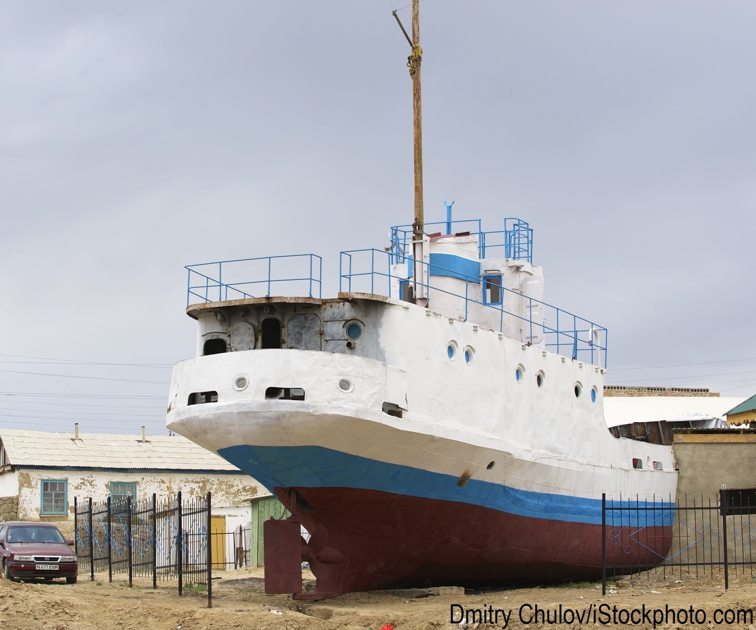 A fishing boat in Aralsk, Kazakhstan remains on shore after no longer being proximate to the evaporating Aral Sea.