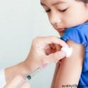 A child receiving a vaccine by injection.