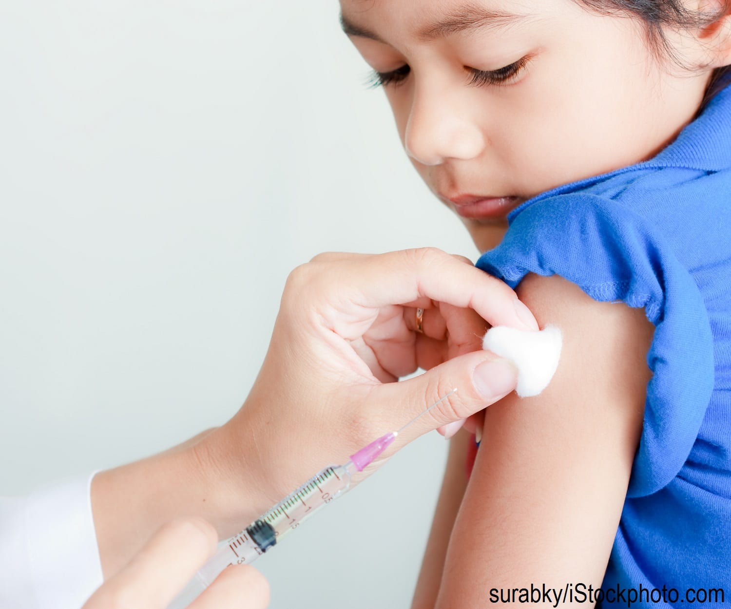 A child receiving a vaccine by injection.