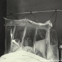 Patient resting in an oxygen tent due to air pollution in Denora, PA, 1948