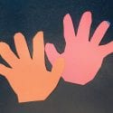 Child's hand print cut out of construction paper for the Earth Day lesson, Lend a Hand to the Earth