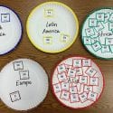 Students use paper plates and counting cards to simulate future population projections
