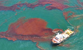 A "vessel of opportunity" skims oil spilled after the Deepwater Horizon/BP well blowout in the Gulf of Mexico in April 2010.