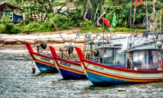 Multicolored (red, white, yellow and blue) traditional fisherman boats in Langkawi, Malaysia