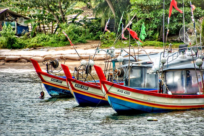 Multicolored (red, white, yellow and blue) traditional fisherman boats in Langkawi, Malaysia