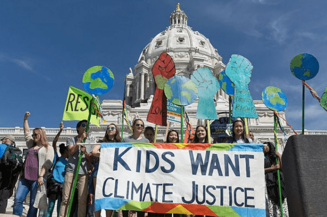 Youth activists rally for climate justice in front of the Minnesota State Capitol
