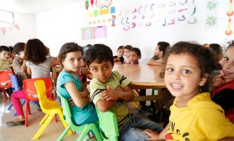 Syrian primary school children attend catch-up learning classes in Lebanon