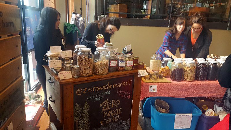 People shop at a zero waste market