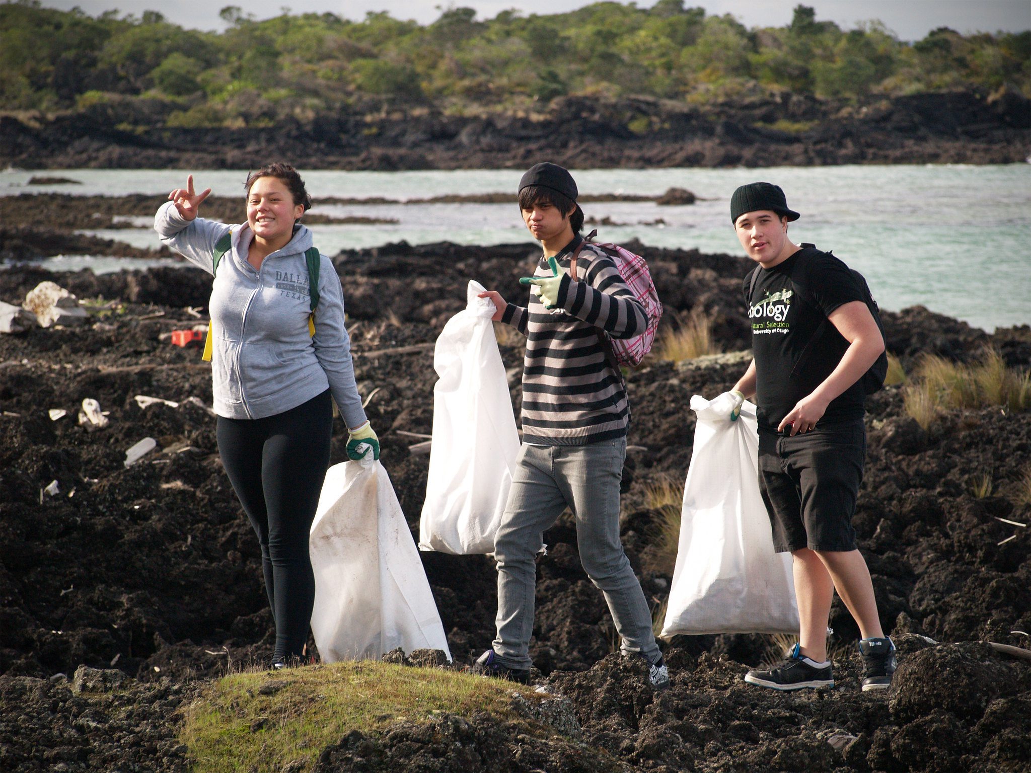 Students clean up trash.