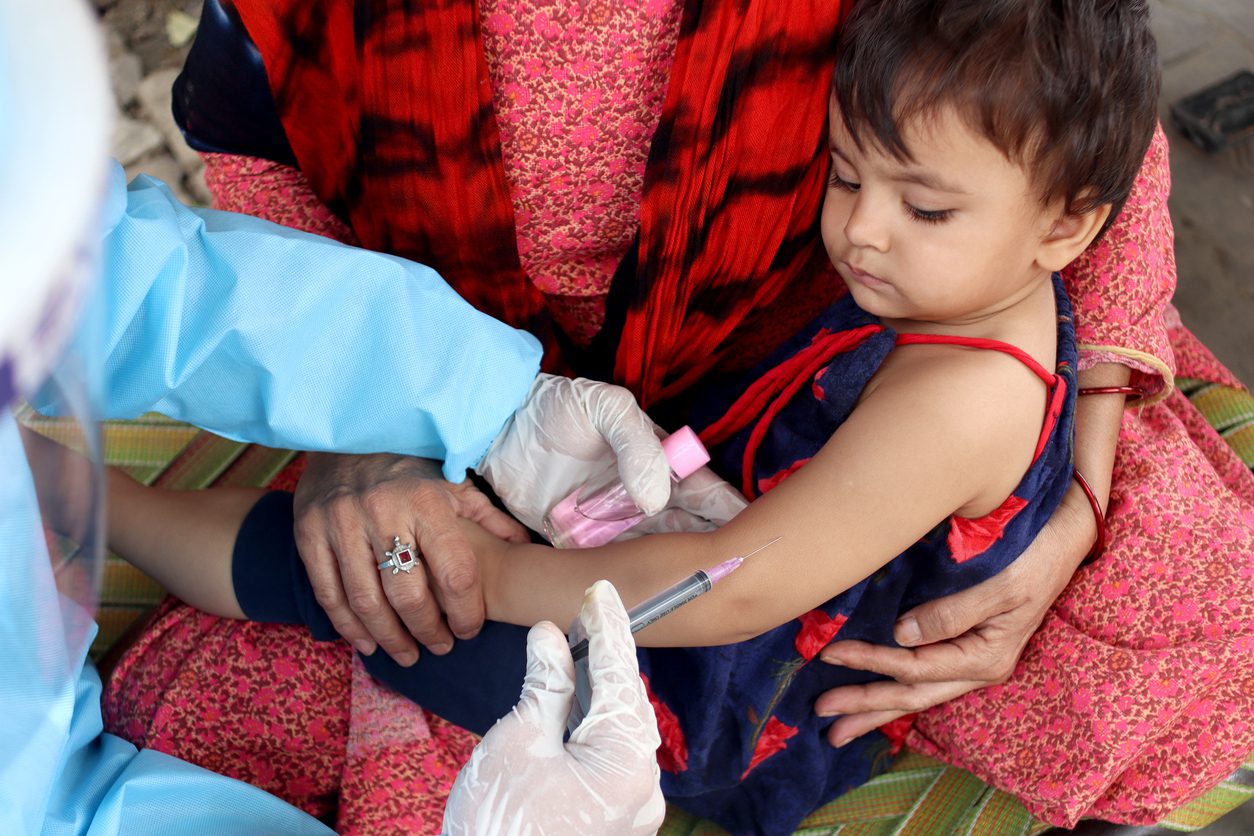 Child receiving vaccine.
