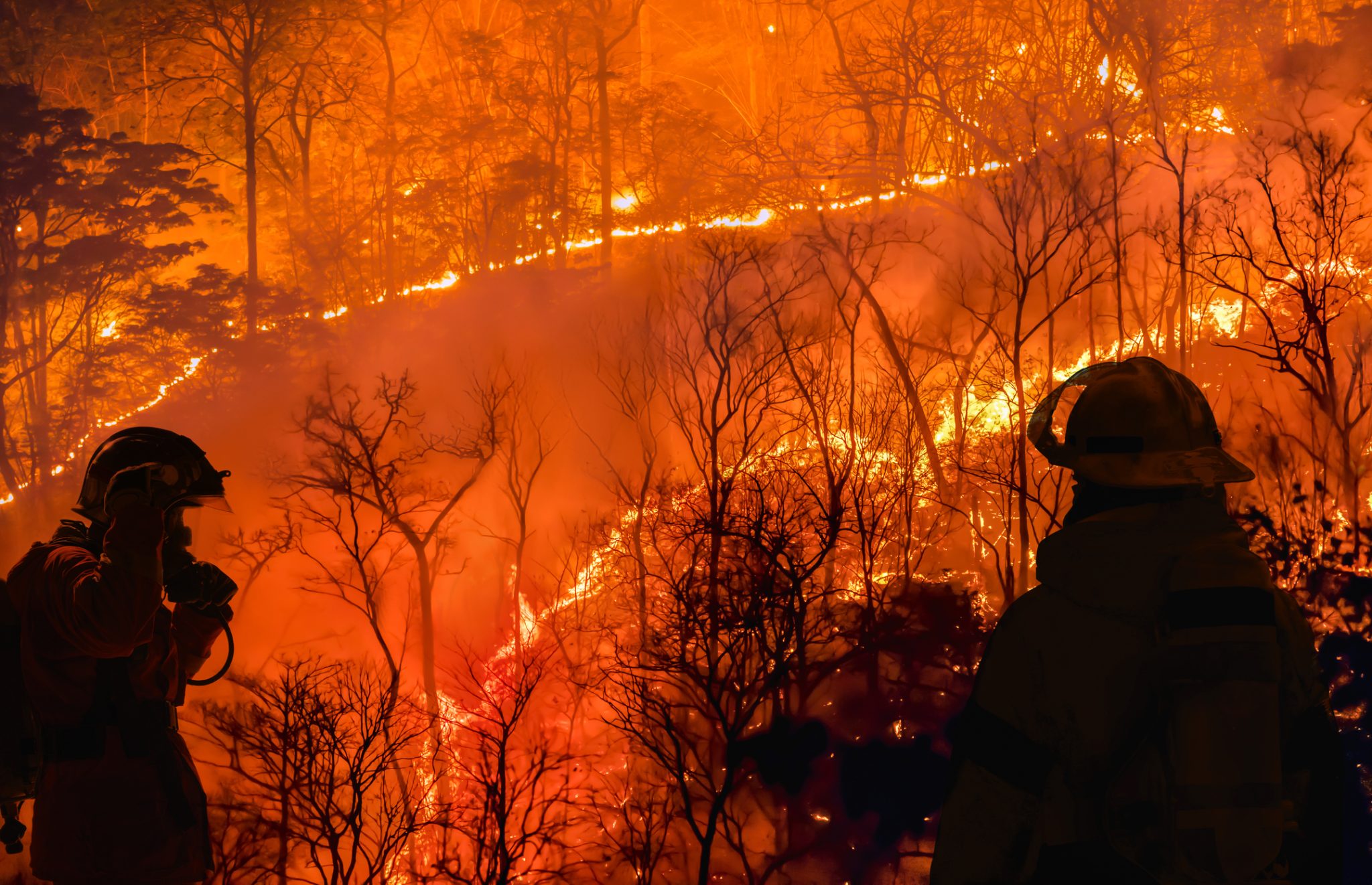 Firefighters battle a wildfire that began due to El Niño events