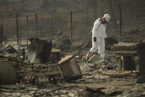 National Guard soldier searching the wreckage of the deadly 2018 Camp Fire in California