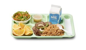 A school lunch tray showing a reimbursable meal for grades 9-12 