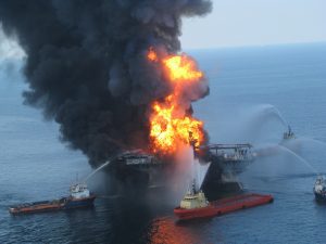 Four boats attempt to hose down a fire on the Deepwater Horizon drilling rig during a disaster that dumped crude oil into the Gulf of Mexico.