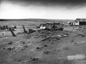 Buried machinery in South Dakota in 1936 during the Dust Bowl.