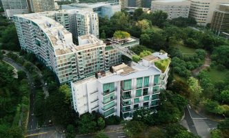 Urban building complex surrounded by trees and green space