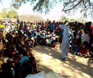 A Lemur Love mascot performs for a local crowd at an educational event in Madagascar.