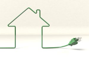 A power cord makes the shape of a house.