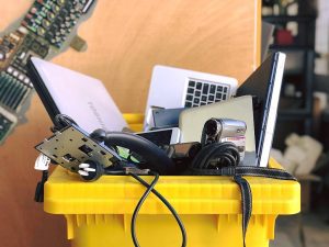 A bin of e-waste, or electronics that have reached the end of their useful life and need to be recycled.