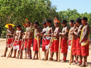 Kayapo Fire Warriors: Following a training on fire-fighting techniques for brush fires, Kayapo youth perform a ritual dance.