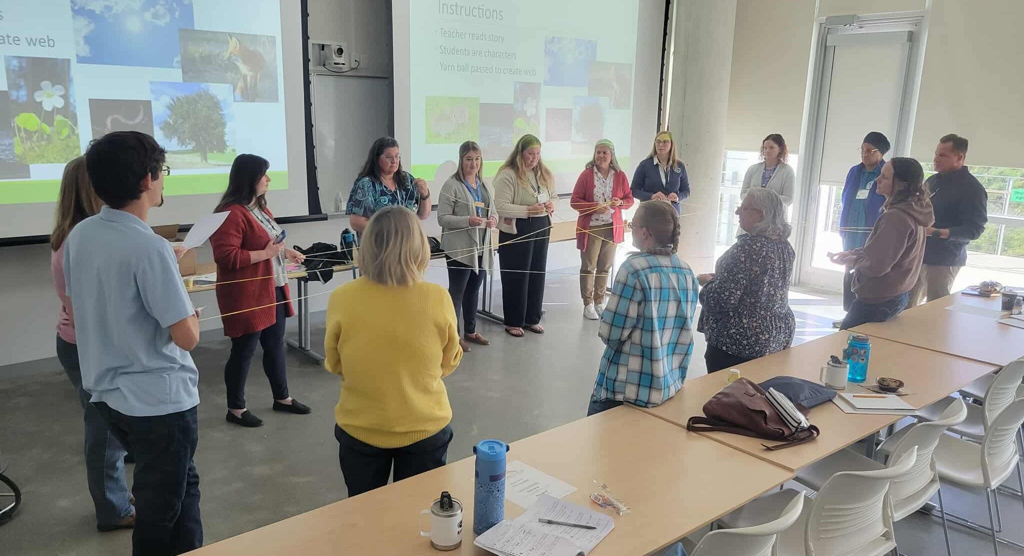 Teachers participate in the Web of Life simulation at the MAMEA conference
