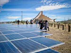 Students in Nevada visit the solar panel field that powers a local museum to learn about renewable energy, an example of place-based learning.