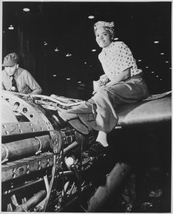 A female riveter works on aircrafts at Lockheed Aircraft Corp during World War II.